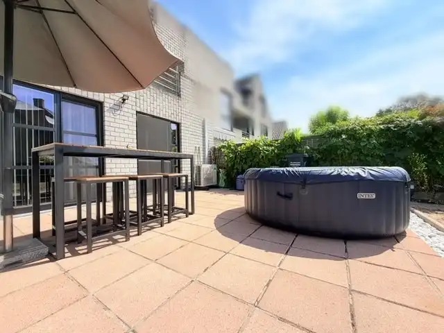 Gelijkvloers appartement met tuin en uitweg foto 7