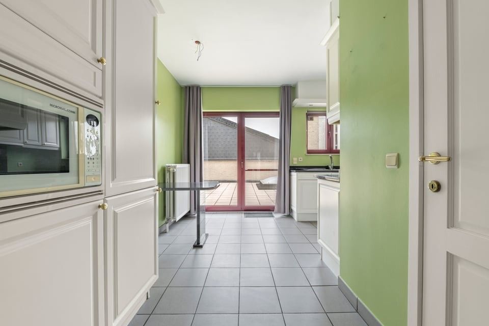 RUIM APPARTEMENT MET UITZONDERLIJK TERRAS VAN +50M² IN SINT-TRUIDEN foto 17