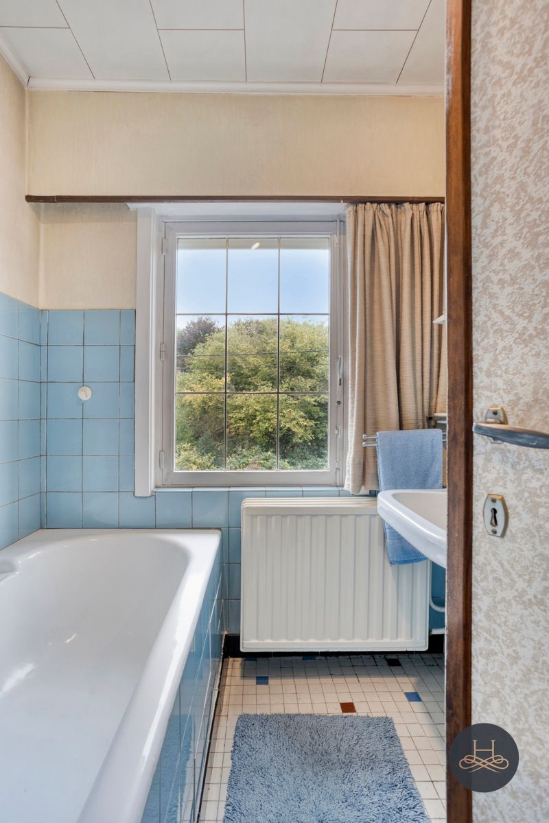 Halfopen woning met tuin en renovatiepotentieel foto 14