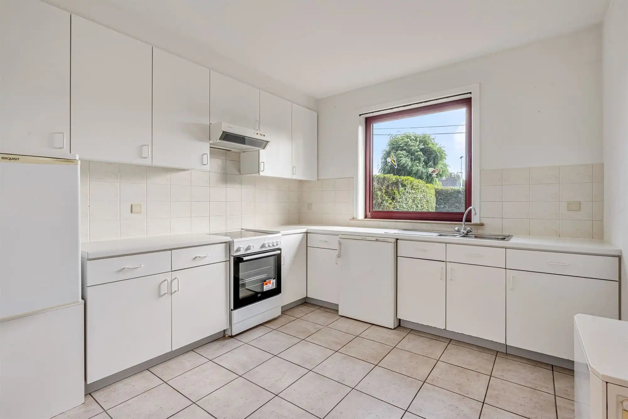 Ruim gelijkvloers appartement met zuidgerichte tuin en garagebox foto 4