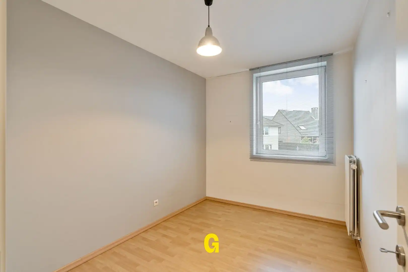 Degelijke instapklare rijwoning met drie slaapkamers, inpandige garage en tuin met terras vlakbij het centrum van Bilzen foto 22