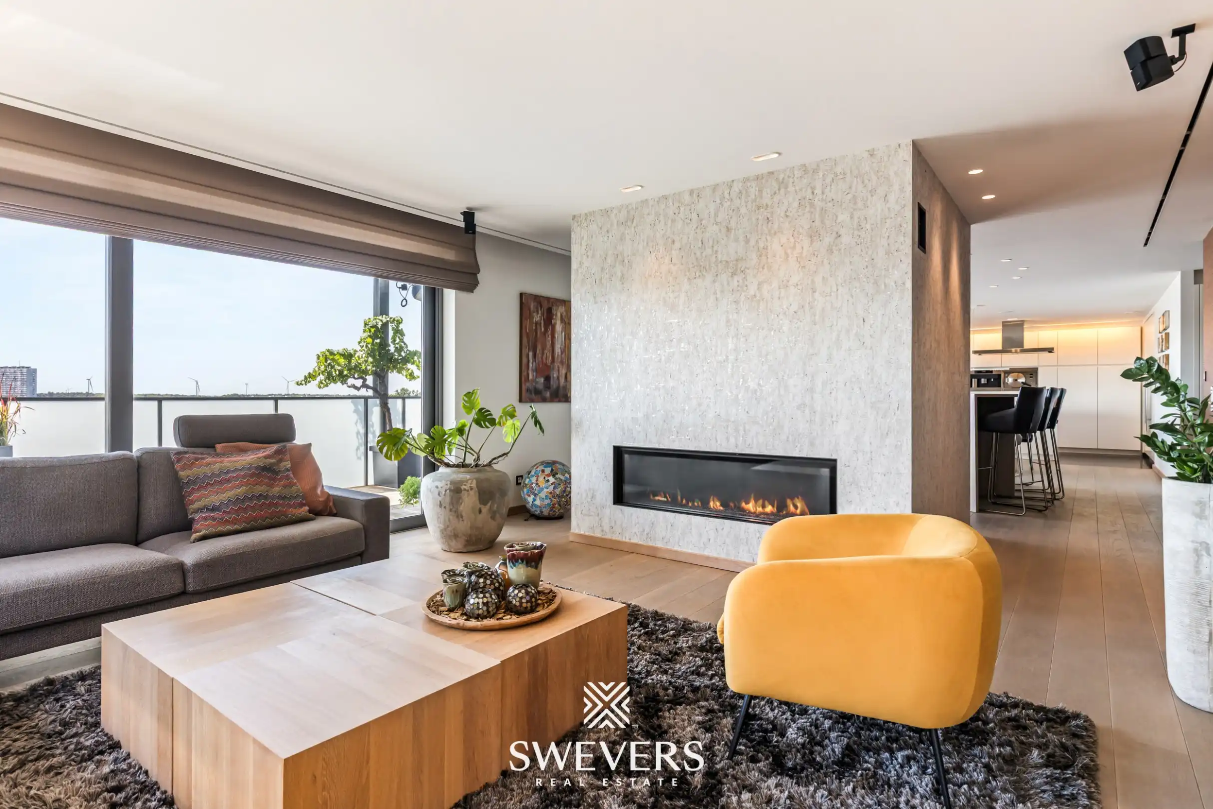 Exclusief penthouse met veel lichtinval en ruim panoramisch terras met prachtig ver uitzicht in centrum Genk foto {{pictureIndex}}