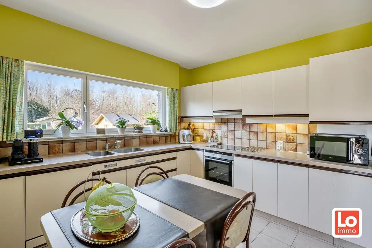 Degelijke open gelijkvloerse woning met inpandige garage en grote tuin op een groene toplocatie in Beervelde! foto 16