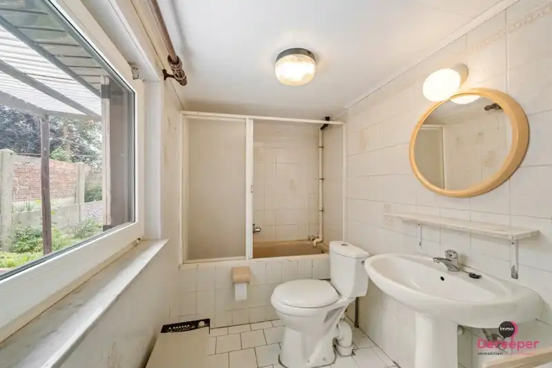 Te renoveren rijwoning op centrale ligging met leuke zuidgerichte tuin foto 11