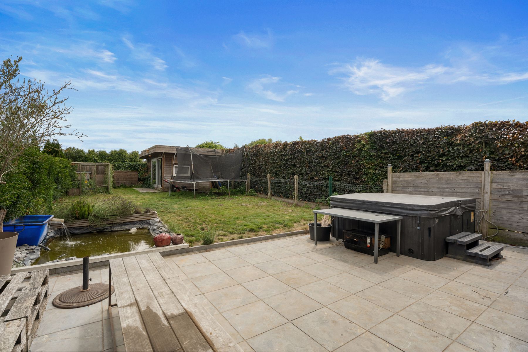 Instapklare halfopen woning met ZO-tuin én garage in Melsen! foto 16