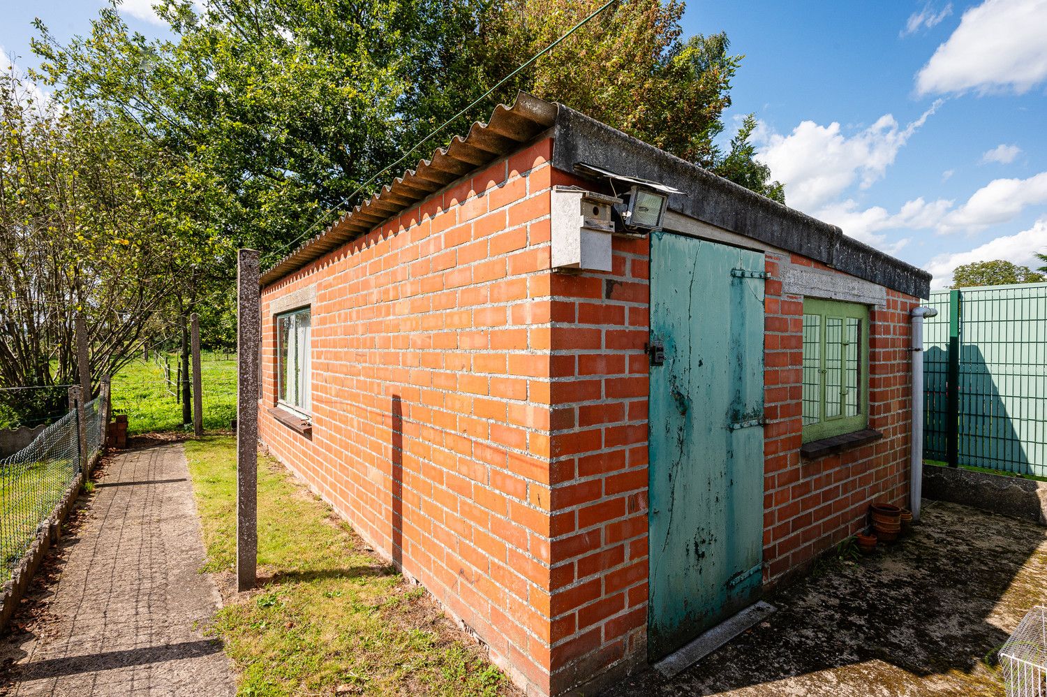 Verrassend ruime woning met prachtig zuidgerichte tuin in het Mandeweegsken! foto 15