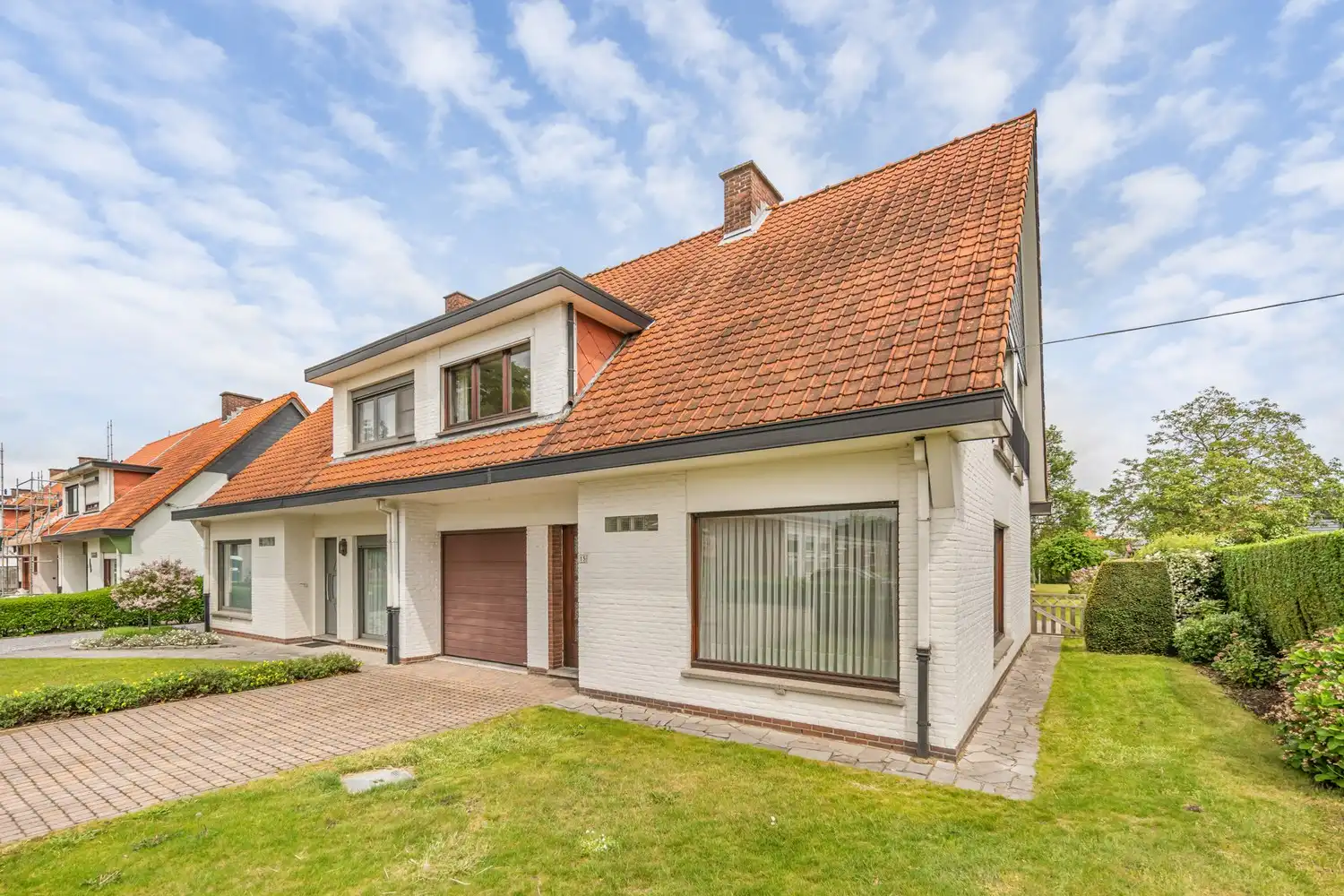 Goed gelegen woning met 4 slaapkamers, een garage en een diepe tuin in een verkeersluwe straat te Kessel-Lo! foto 2