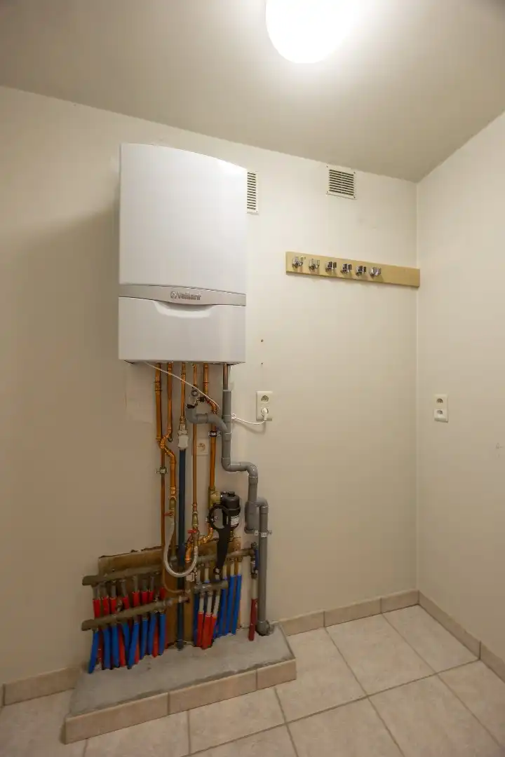 Ruim gelijkvloers appartement met terras en 2 slaapkamers te Overpelt centrum. foto 10