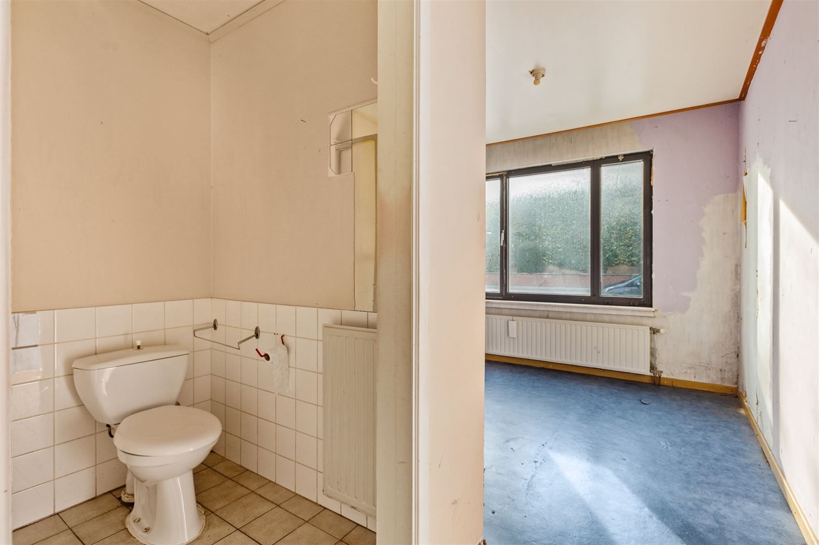 Te renoveren gelijkvloers appartement met garagebox foto 9