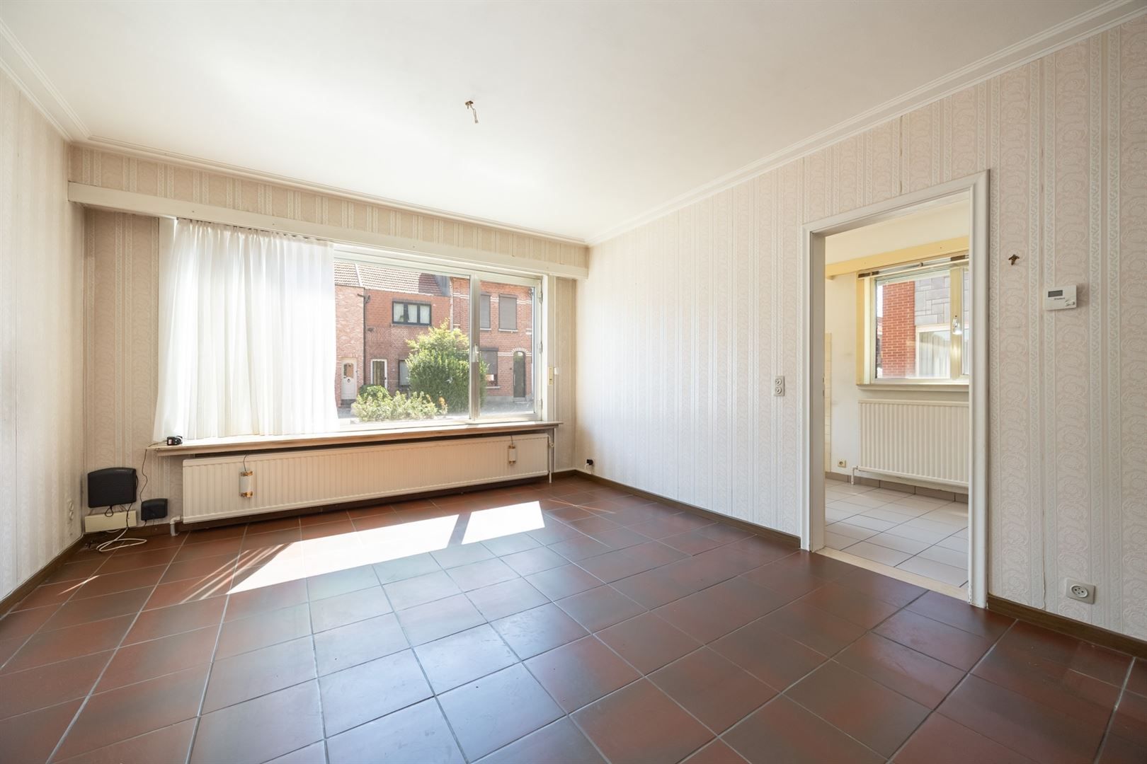 Halfopen gelijkvloers appartement met garage foto 4