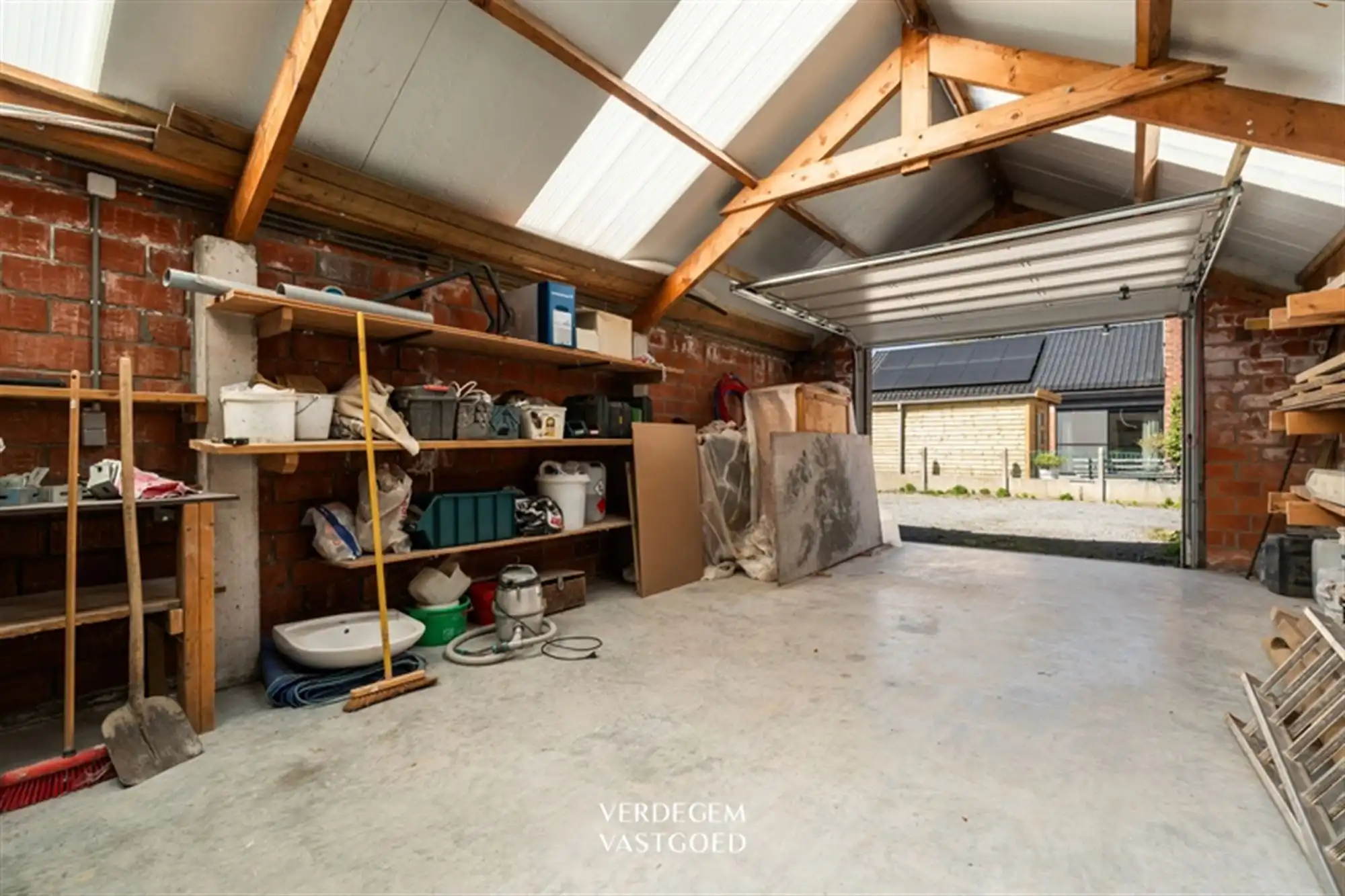 Opbrengsteigendom met 2 appartementen en 4 garages in het centrum van Sleidinge  foto 27