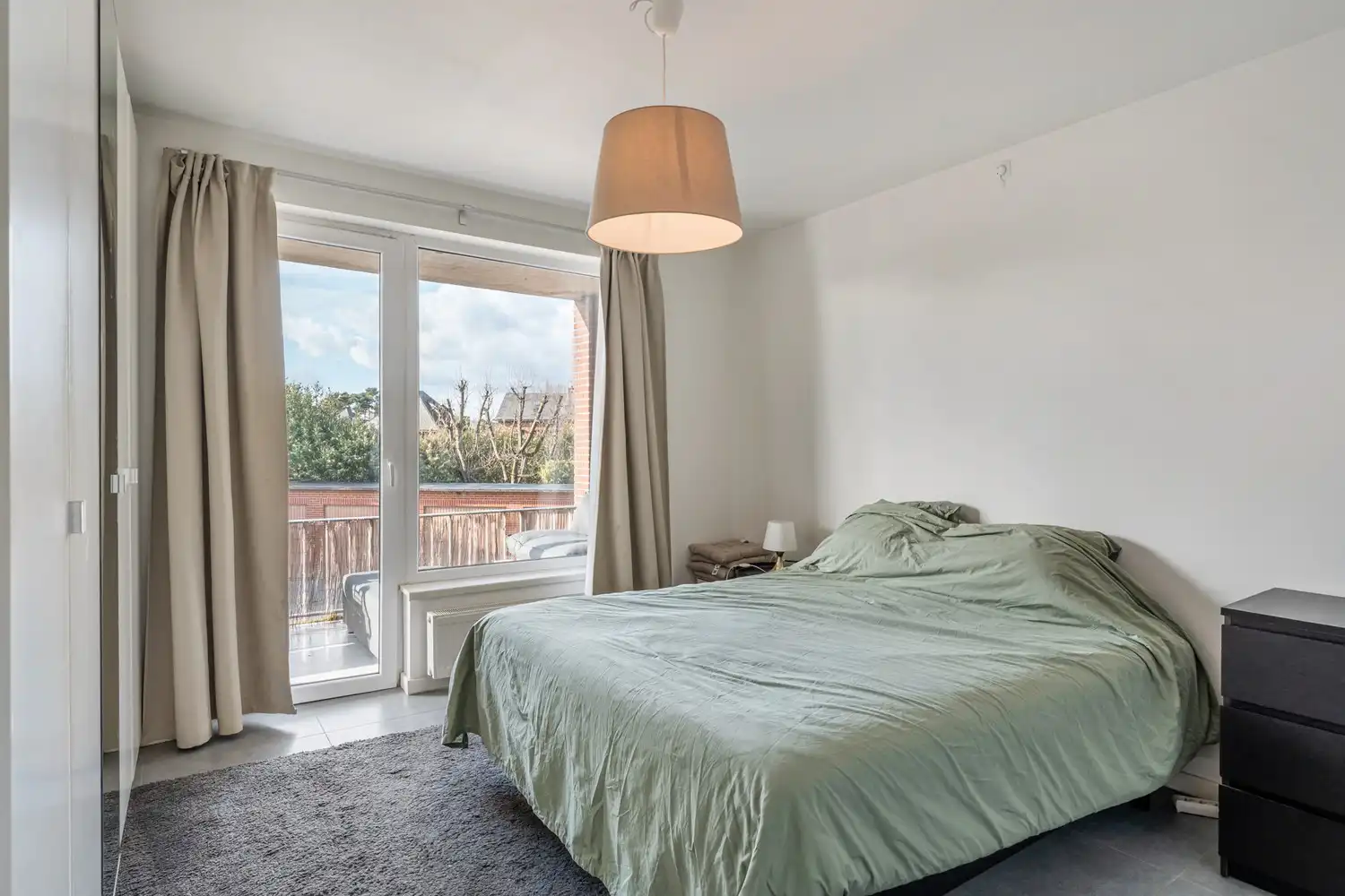 Gerenoveerd en lichtrijk appartement met 2 mooie slaapkamers, een ruim terras en een garagebox te Herent! foto 12