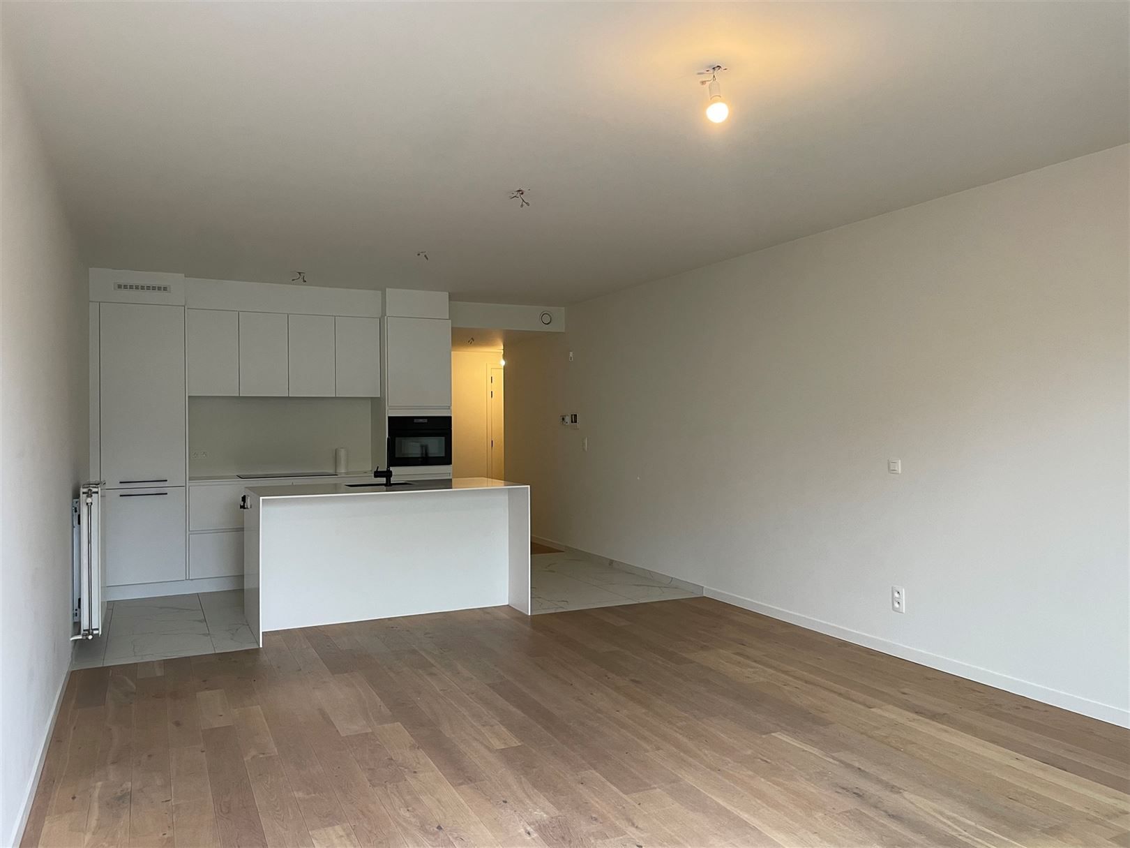 Gelijkvloers appartement met zonnig tuintje. foto 3