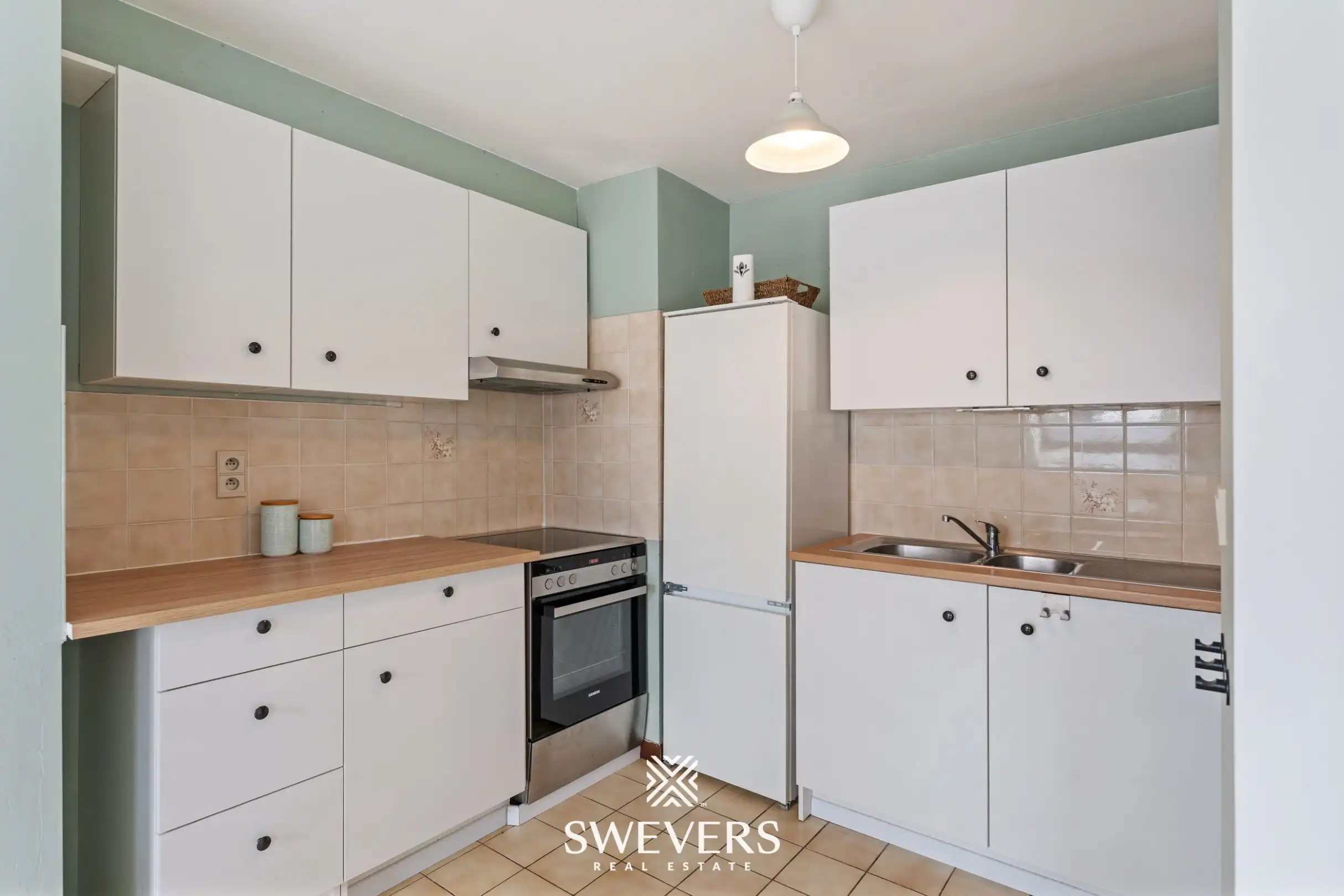 Instapklaar en lichtrijk 1-slaapkamerappartement op topligging in Houthalen centrum foto 9