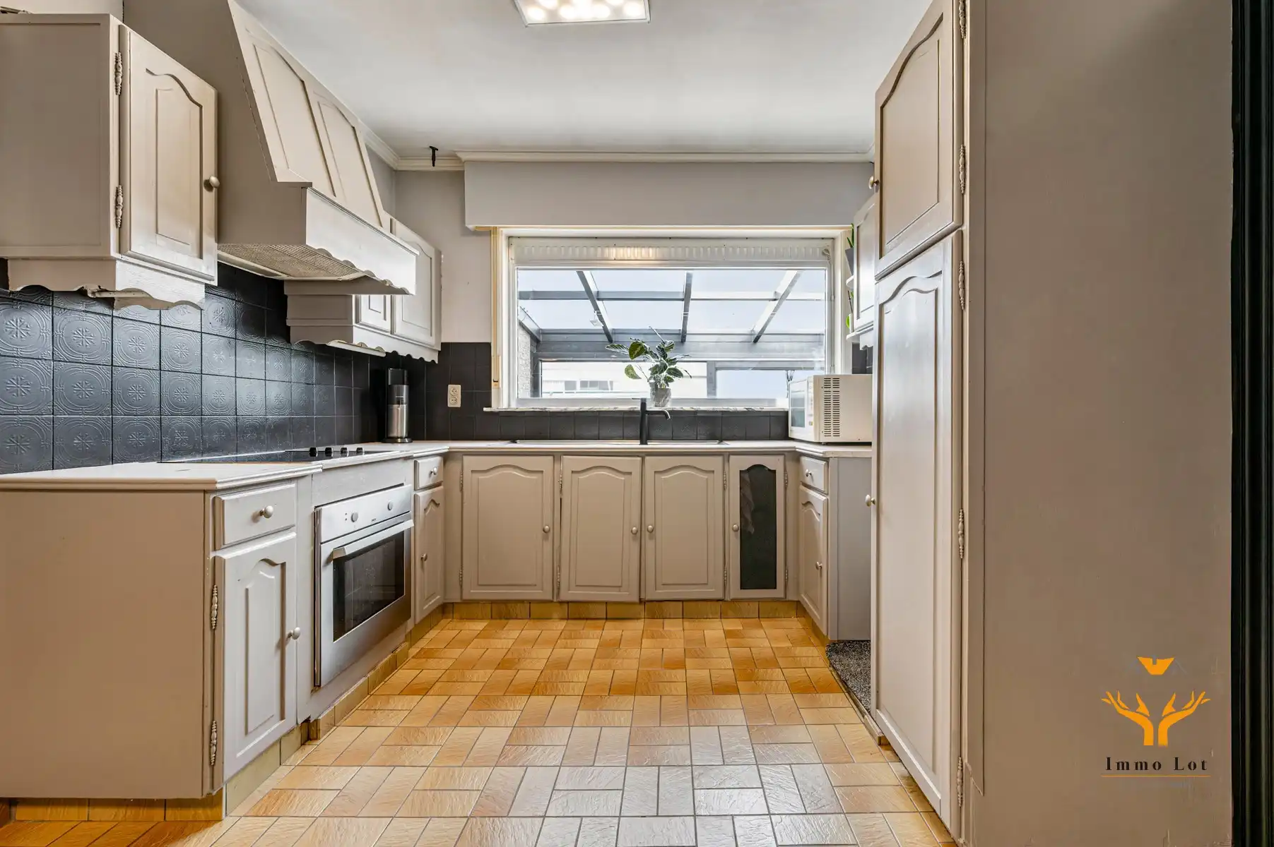 Halfopen bebouwing met tuin en garage in centrum Kalken foto 9