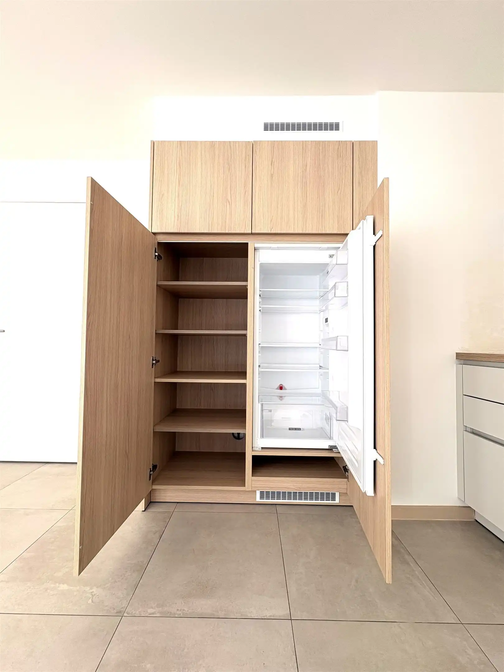 Modern en instapklaar gelijkvloers appartement met terras, tuin en ondergrondse staanplaats in Grembergen foto 7