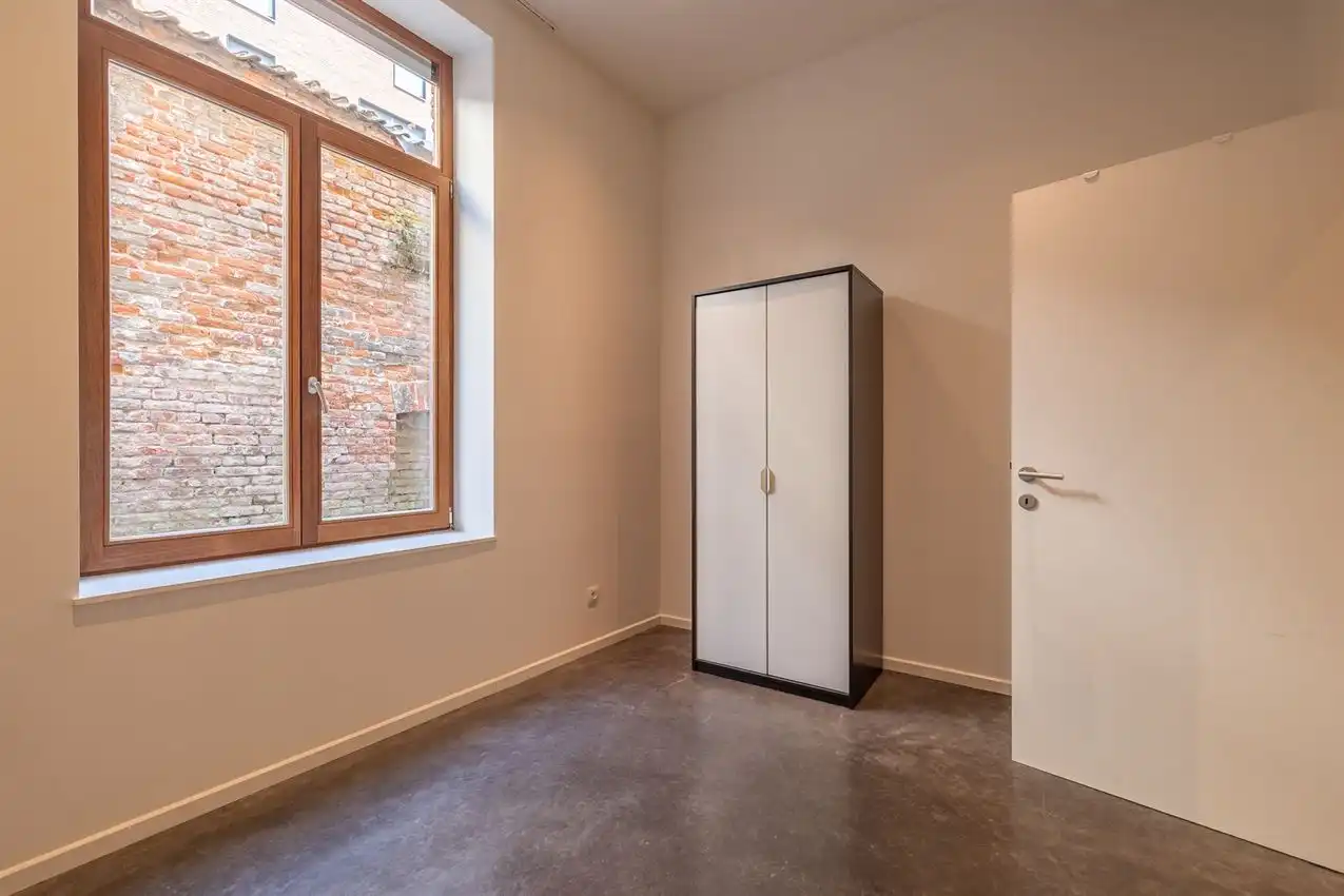 Ruim gelijkvloers appartement met zonnige tuin op toplocatie foto 18