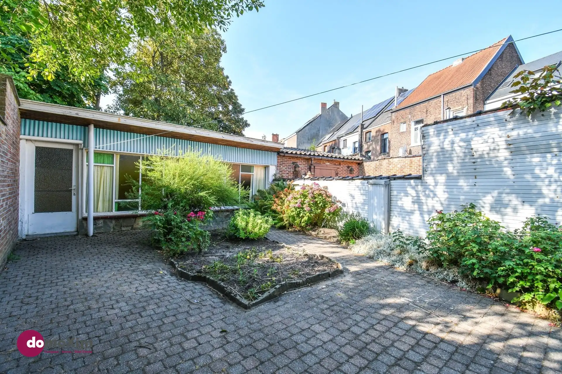 Te renoveren stadswoning met zuid-gerichte tuin en garage foto 13
