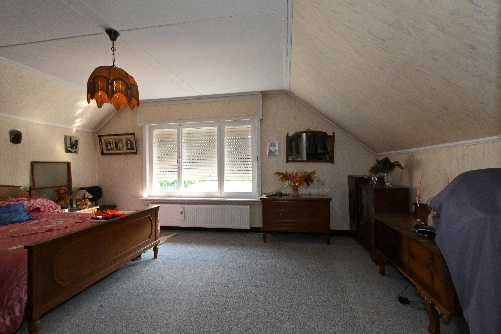 Alleenstaande woning met carport en tuin foto 20