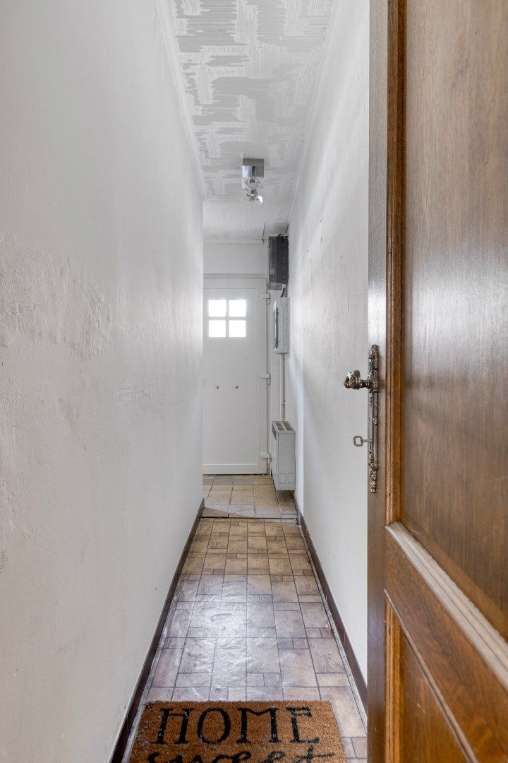 Gezellig ingerichte woning met hobbyruimte en tuin + toegang achterom foto 11