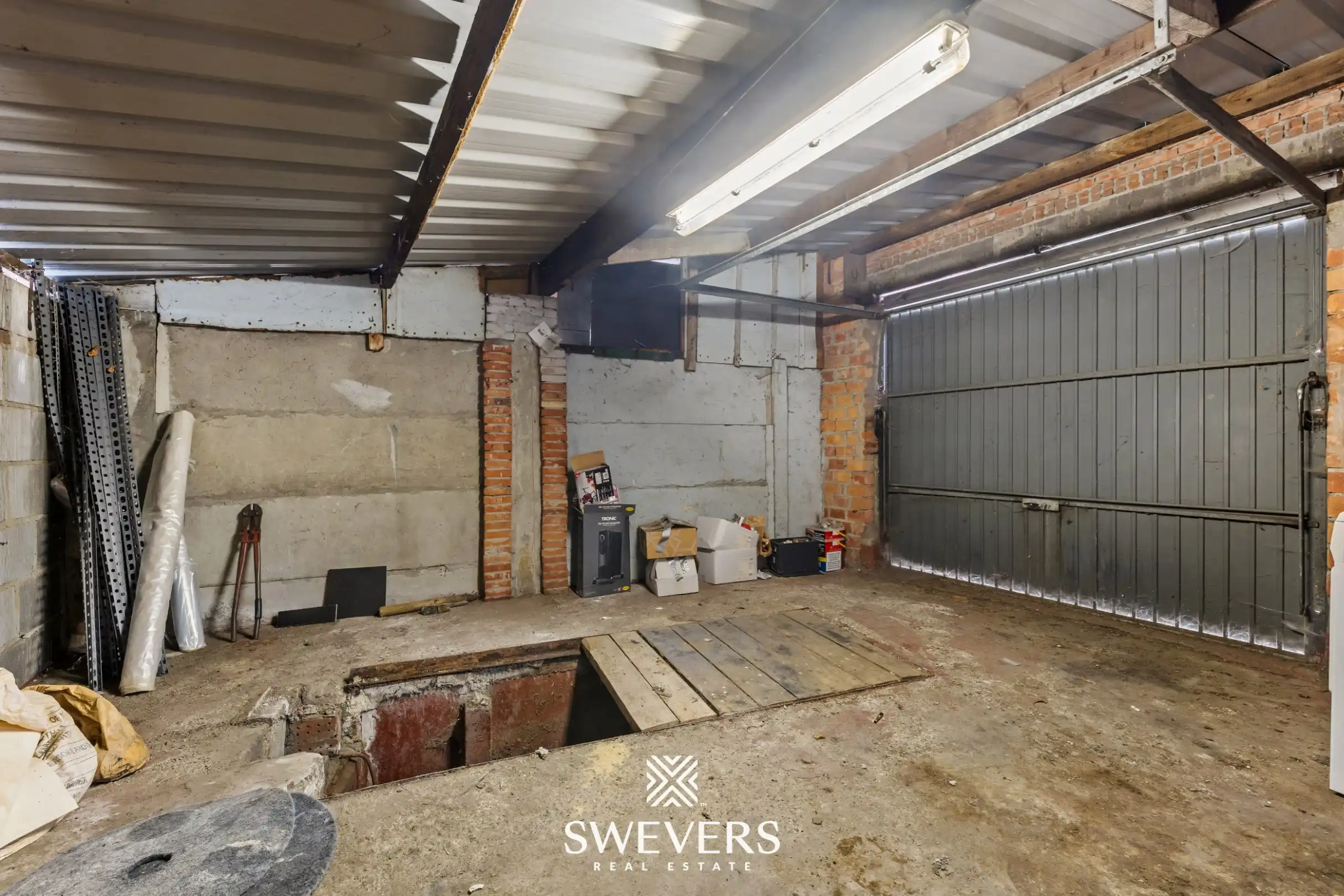Te renoveren woning met 4 slaapkamers en 4 garages te Beringen foto 22