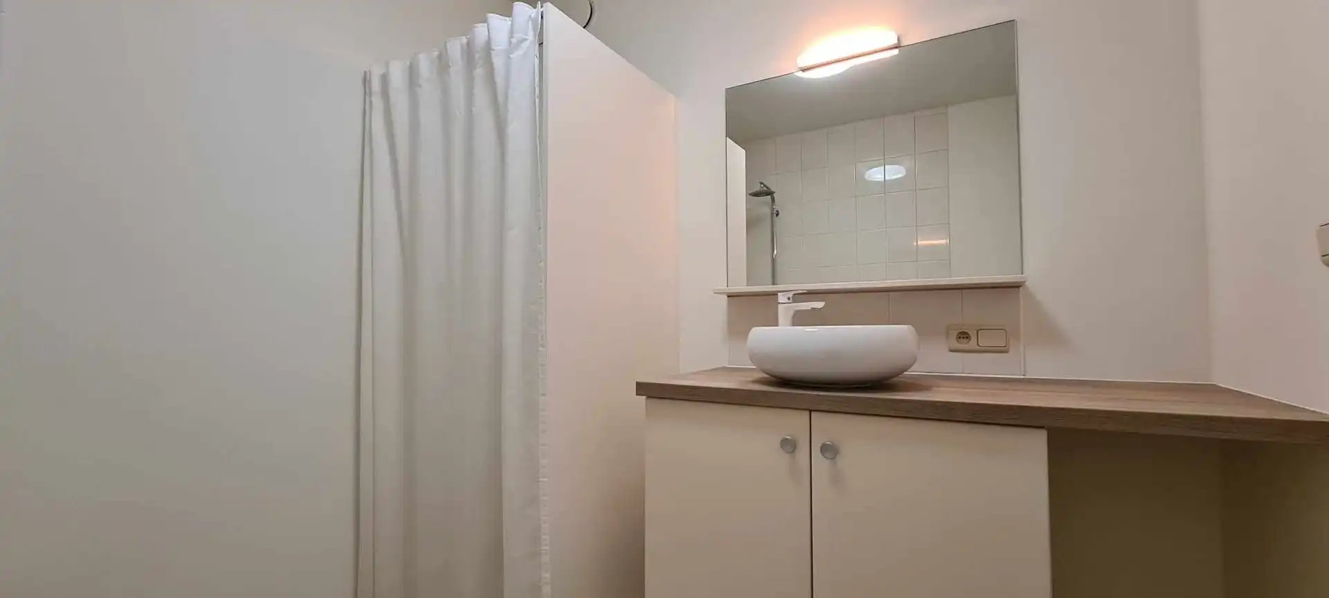 Charmant 2 slpk-appartement met autostaanplaats in residentiële buurt foto 12