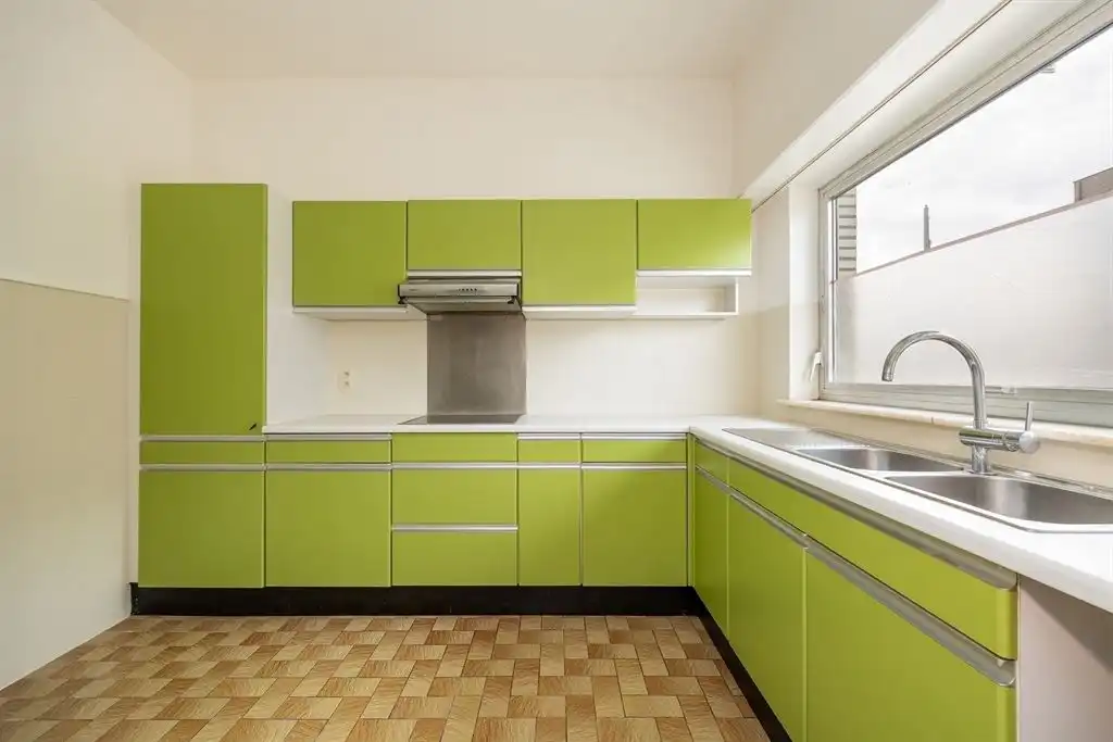 Instapklaar gelijkvloersappartement met stadskoer foto 4