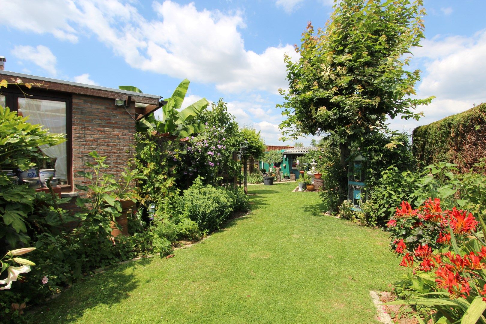 Charmante woning met veranda en mooie tuin in een rustige, landelijke omgeving foto 27
