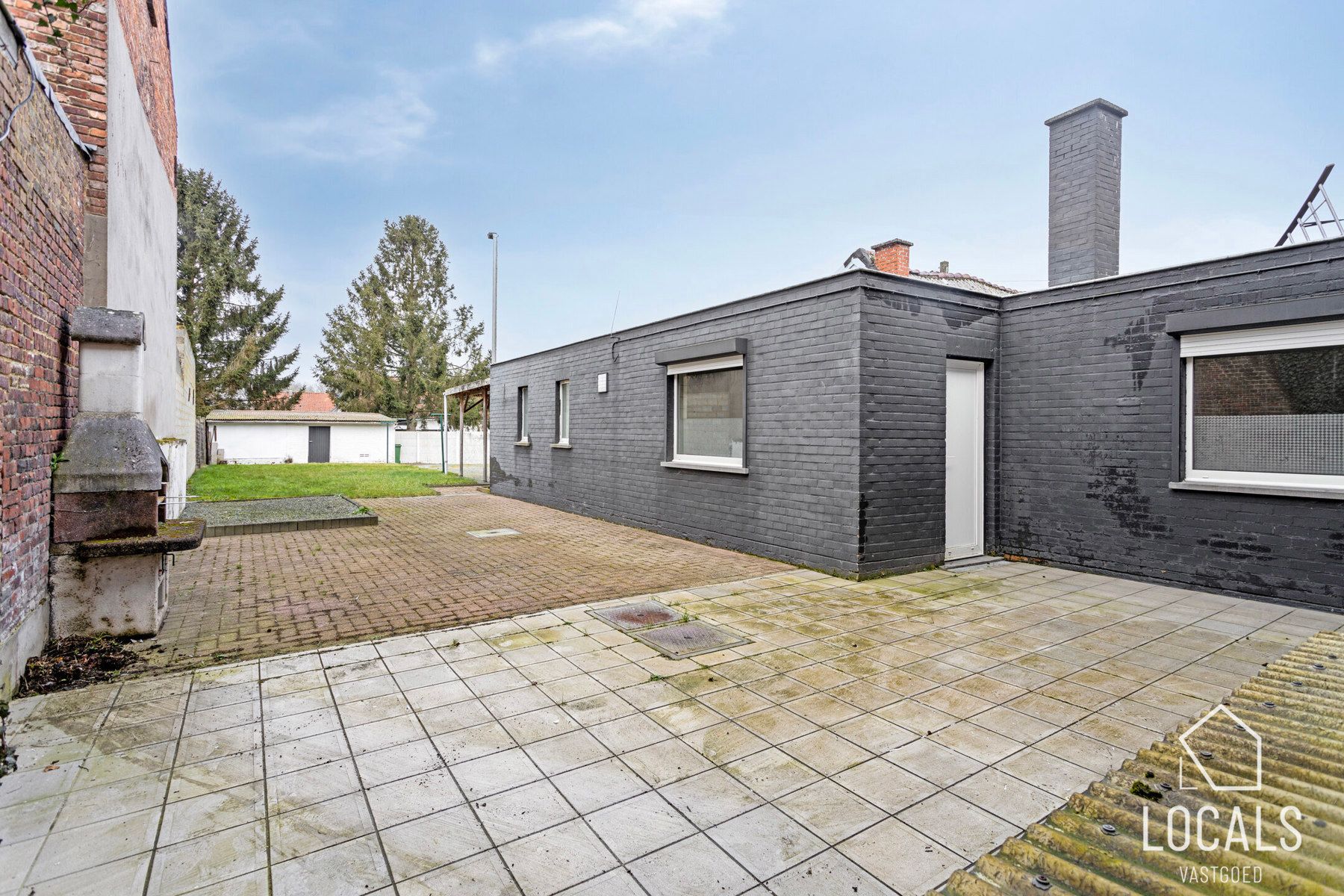 Veelzijdig pand: handelsruimte met woonst & parkeerplaatsen foto 23