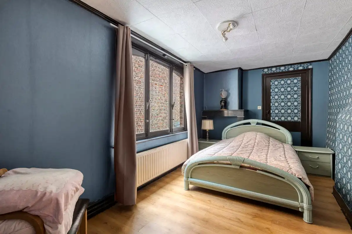 Opbrengsteigendom met renovatiepotentieel op toplocatie in Kortrijk foto 7