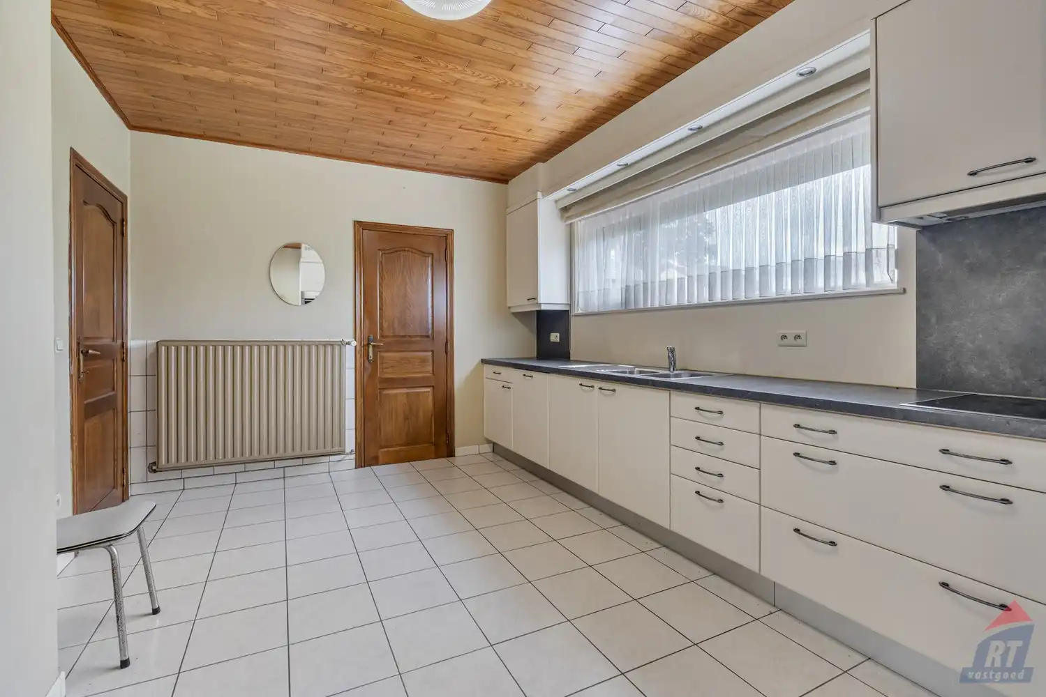 Rustig gelegen, op te frissen woning in Alken foto 4