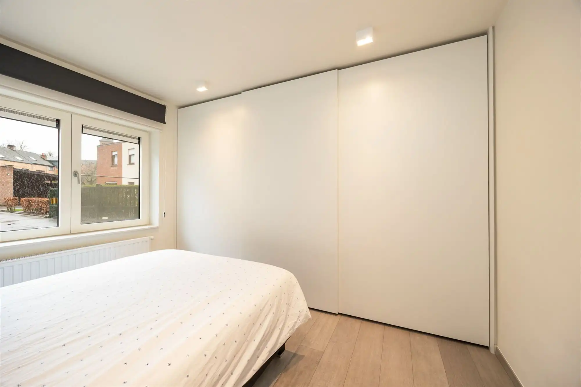 Instapklaar gelijkvloers appartement met tuin en carport foto 12