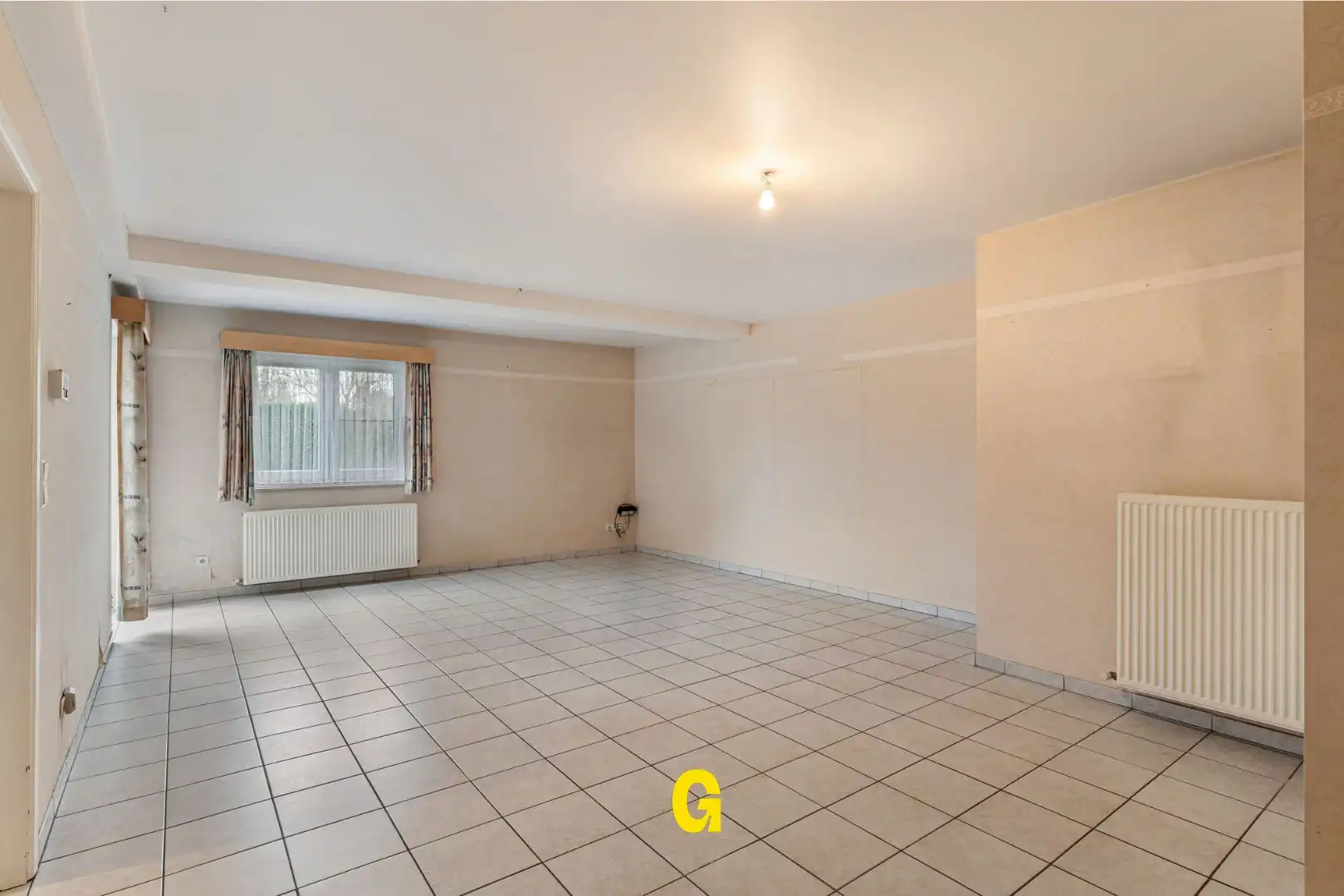 Degelijk (rolstoelvriendelijk) gelijkvoersappartement met terras uitgevend op de tuin, afsluitbare garage en berging foto 7