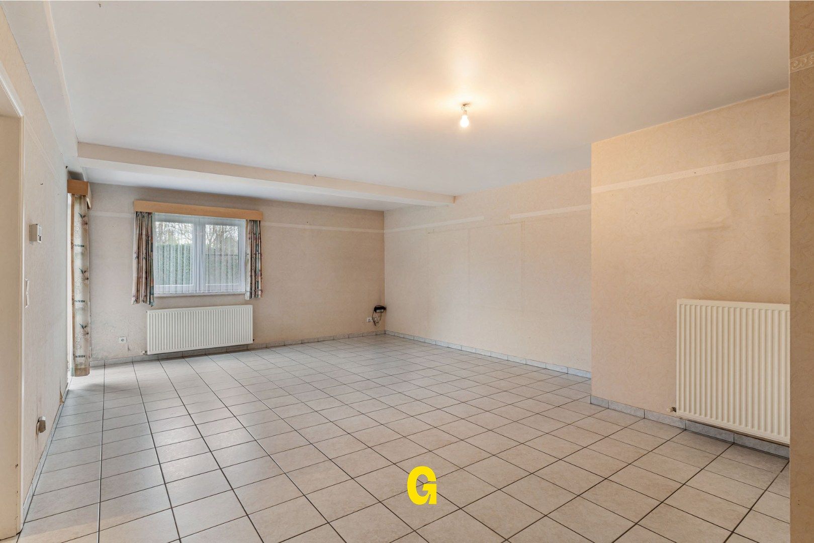 Degelijk (rolstoelvriendelijk) gelijkvoersappartement met terras uitgevend op de tuin, afsluitbare garage en berging foto 7