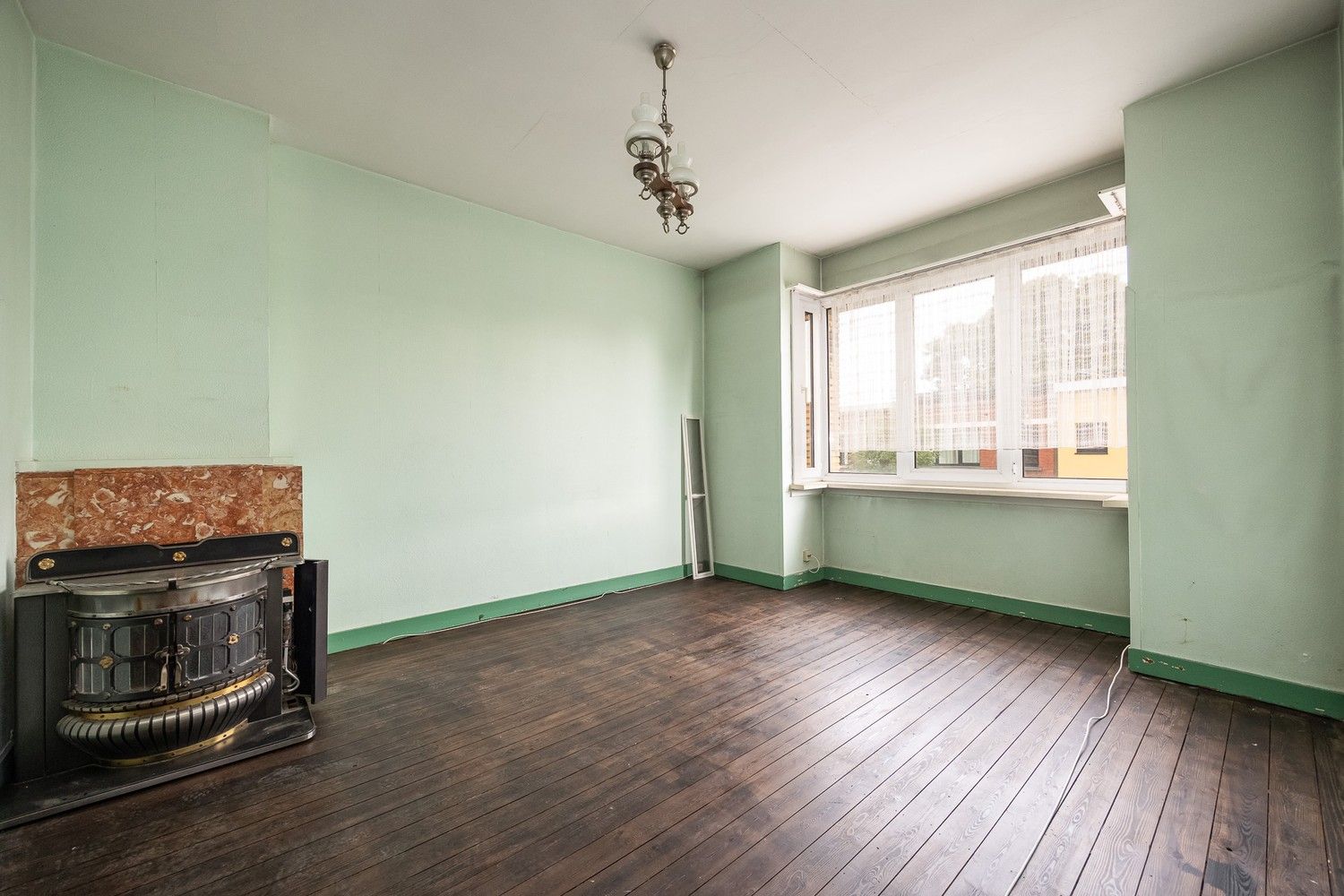 Te renoveren opbrengsteigendom met 3 éénslaapkamerappartementen nabij het Boekenbergpark foto 8
