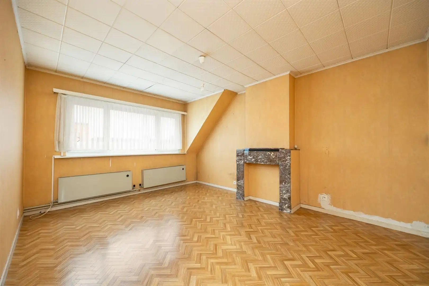 Ruime gezinswoning met zonnige tuin en renovatiepotentieel foto 19