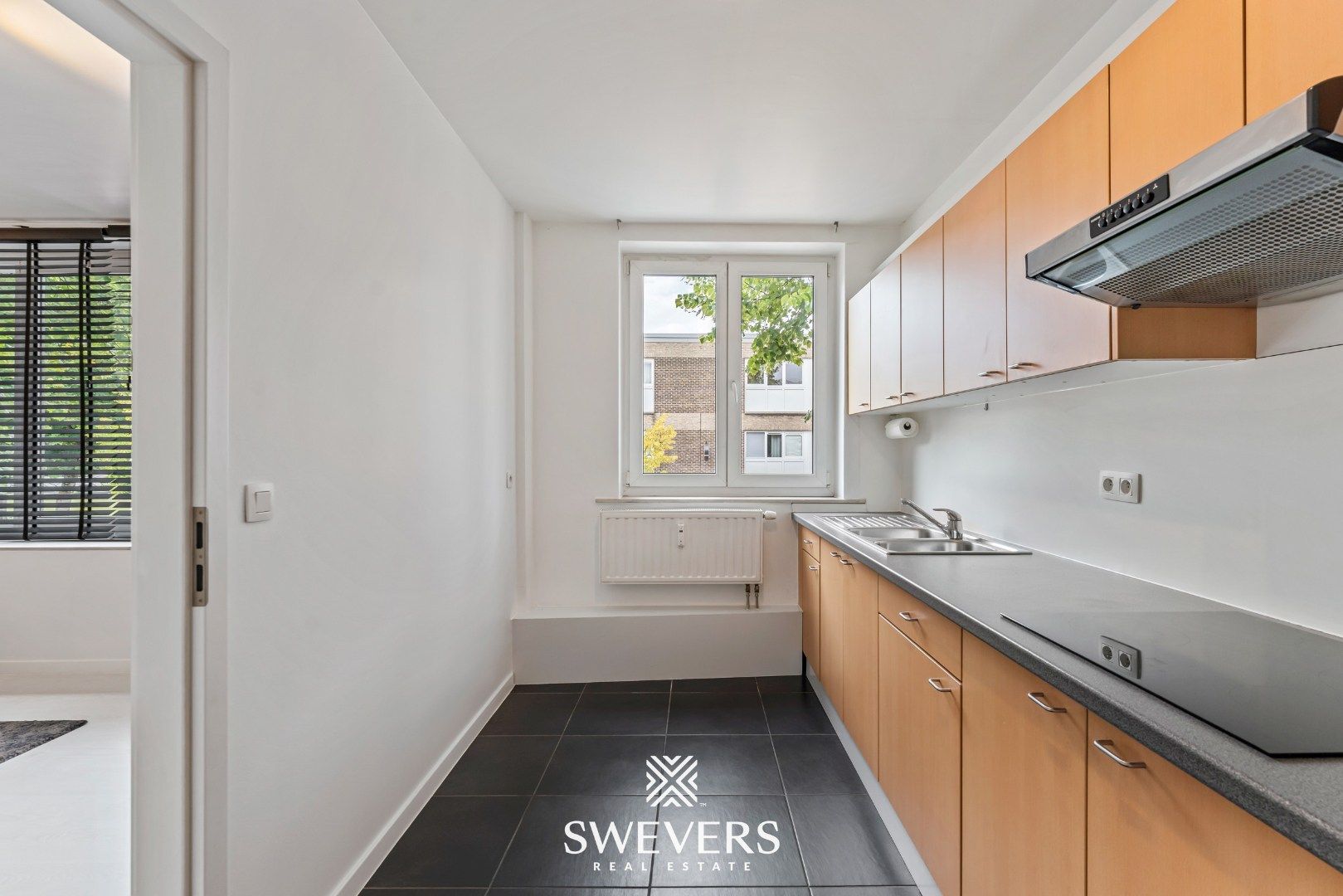 Instapklaar en energiezuinig 2-slaapkamerappartement in het centrum van Heppen foto 12