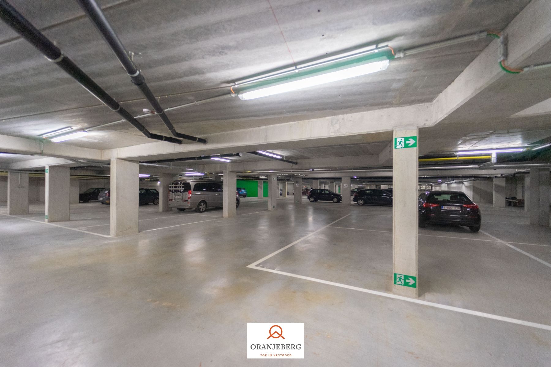 Nieuwbouw autostaanplaats te huur in afgesloten parkeergarage nabij Gent centrum foto 7