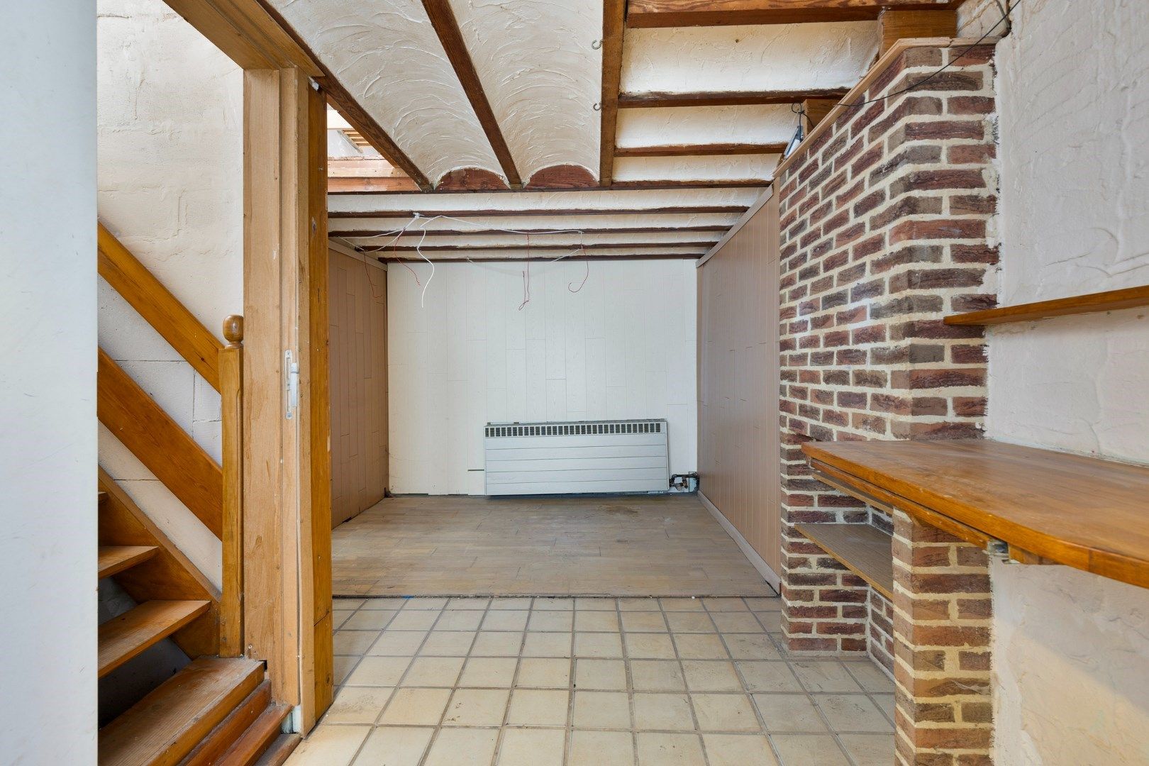 Halfopen hoekwoning met garage en dakterras op toplocatie in Kessel-Lo – renovatieproject met veel potentieel foto 12