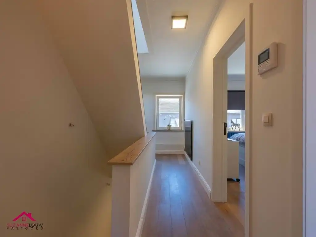 Instapklare woning met handelsruimte in gesloten bebouwing foto 25