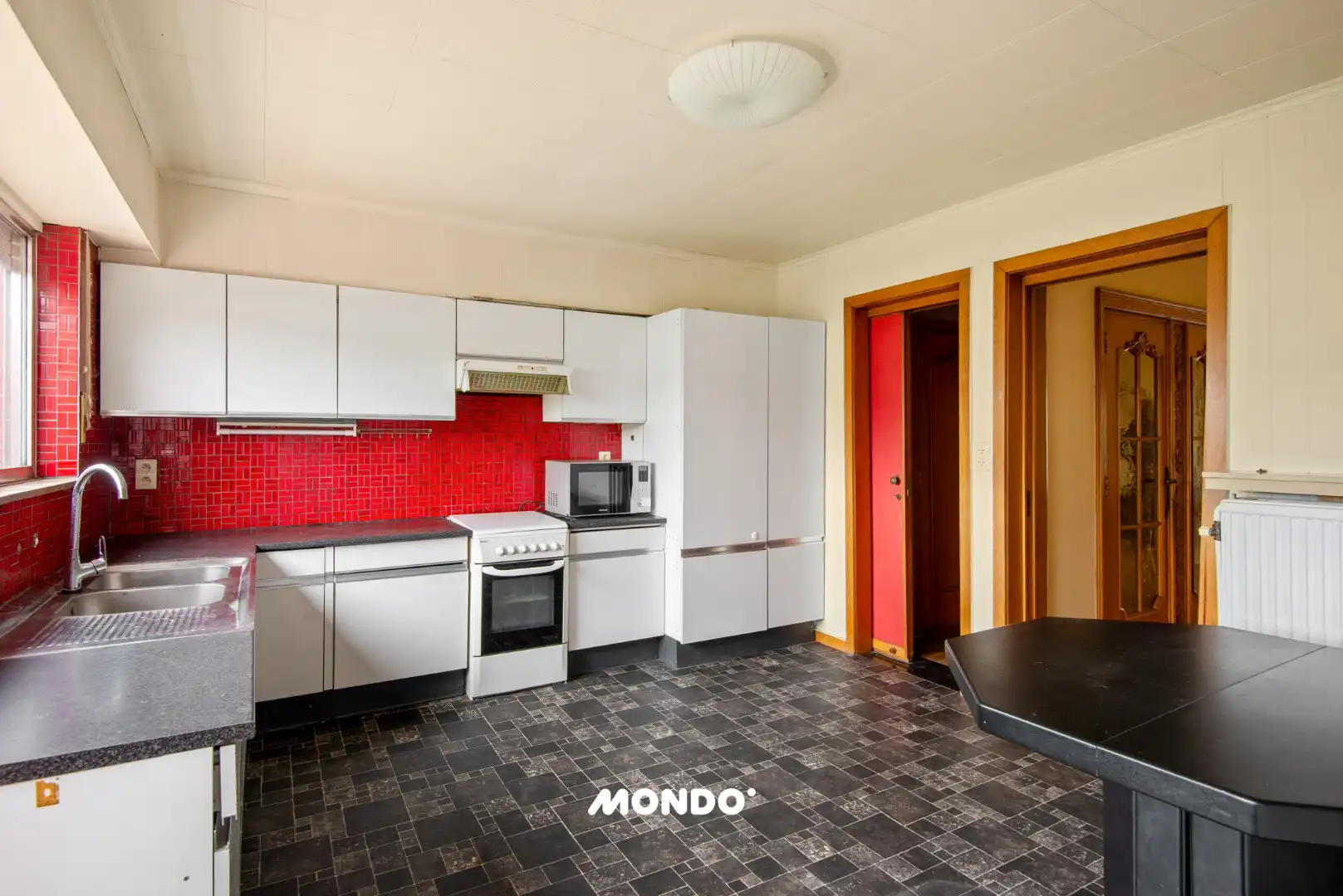 Ruime woning met 2 slaapkamers, garage, twee terrassen en tuin  foto 6