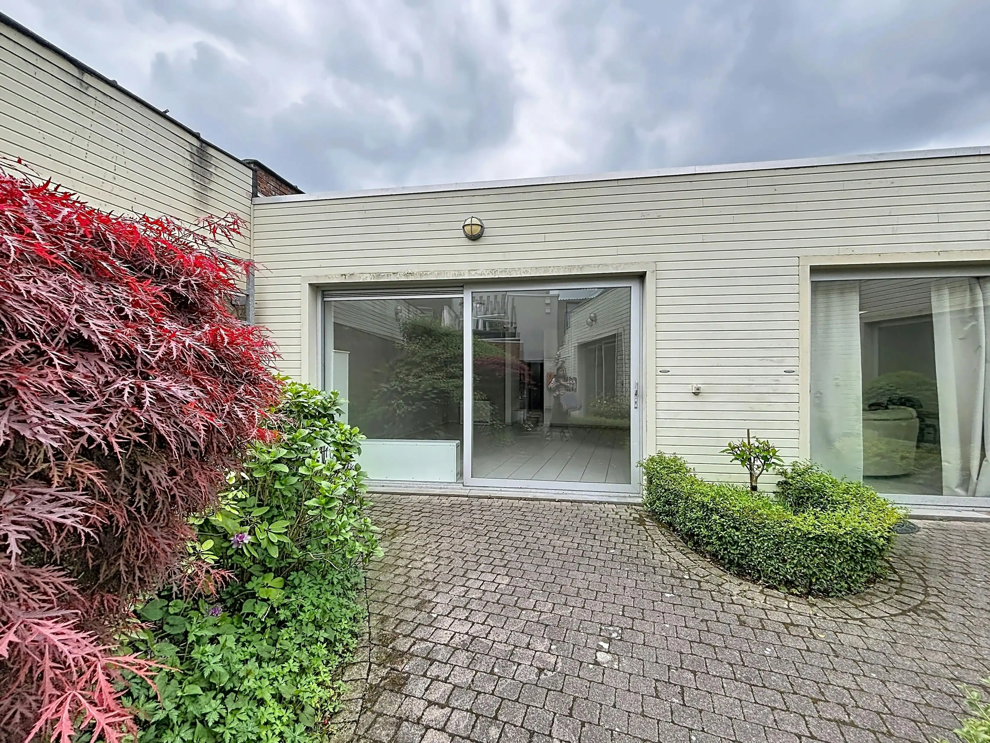 Instapklaar gelijkvloers appartement met gemeenschappelijke tuin en fietsenberging in hartje Kapellen! foto 2