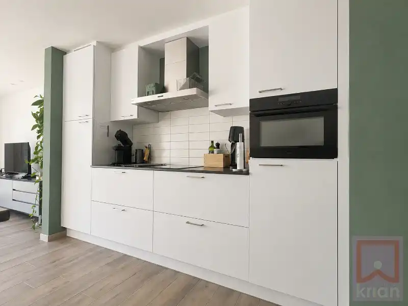 Volledig instapklaar gelijkvloers appartement met 2 slaapkamers, ruime tuin én garagebox foto 8