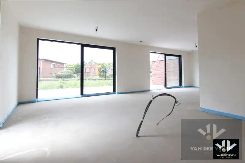 Ruim gelijkvloers nieuwbouwappartement met 4 slaapkamers en 2 badkamers, ruim terras en een mooie tuin op een goed bereikbare locatie! foto 7