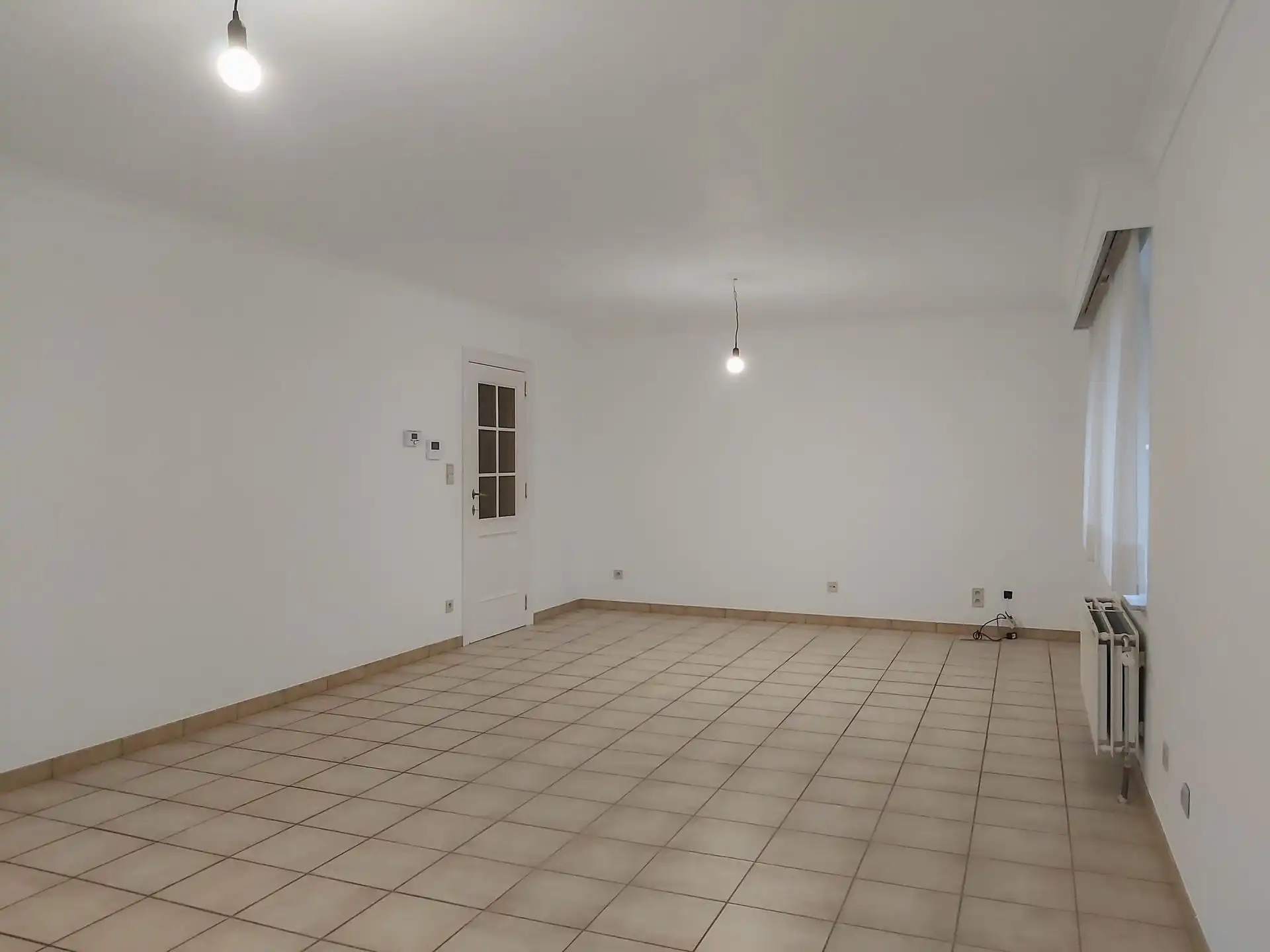 Gelijkvloers appartement met 2 slaapkamers, autostaanplaats en kelderberging in Maasmechelen! foto 4