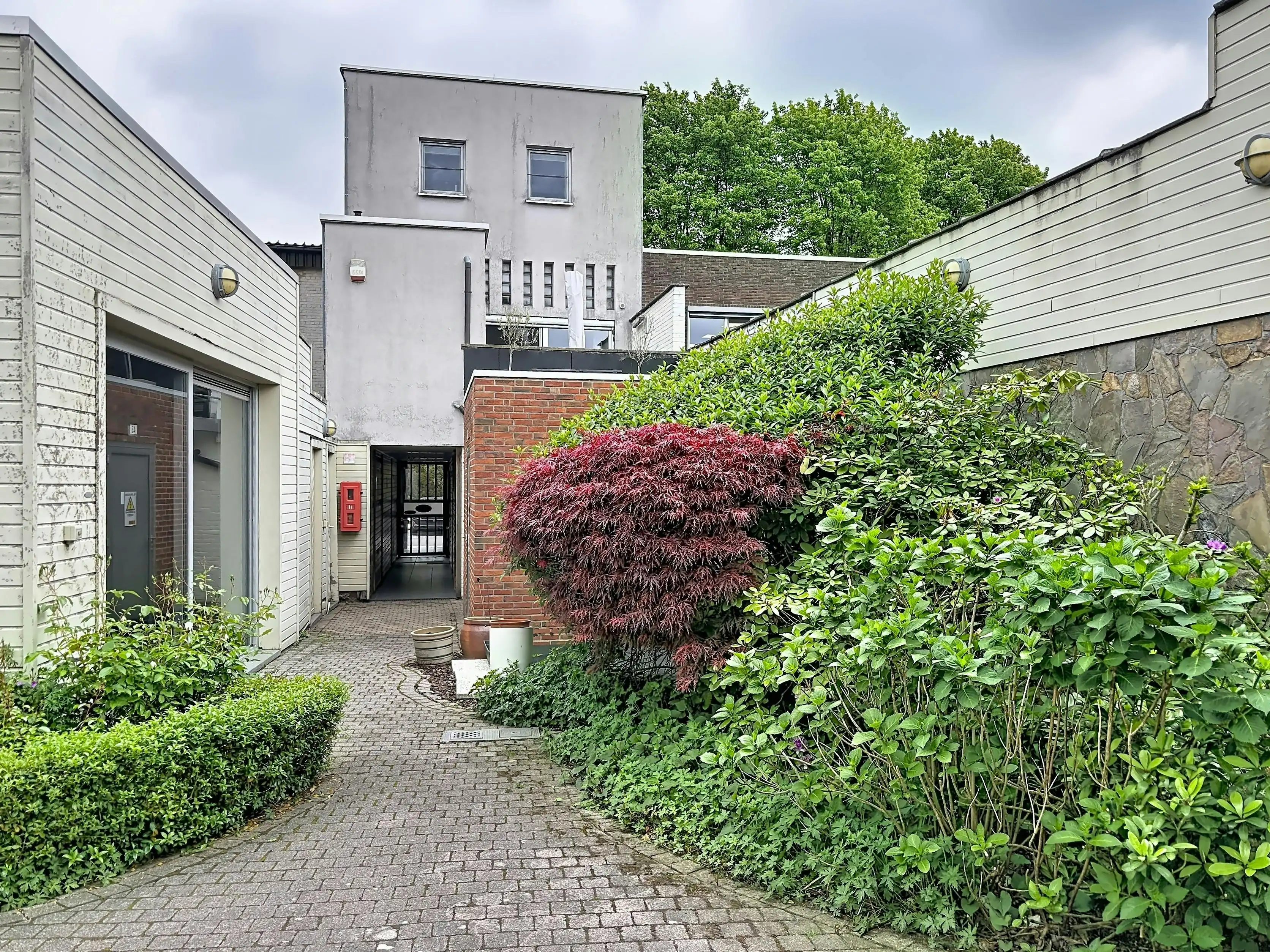 Instapklaar gelijkvloers appartement met gemeenschappelijke tuin en fietsenberging in hartje Kapellen! foto 15