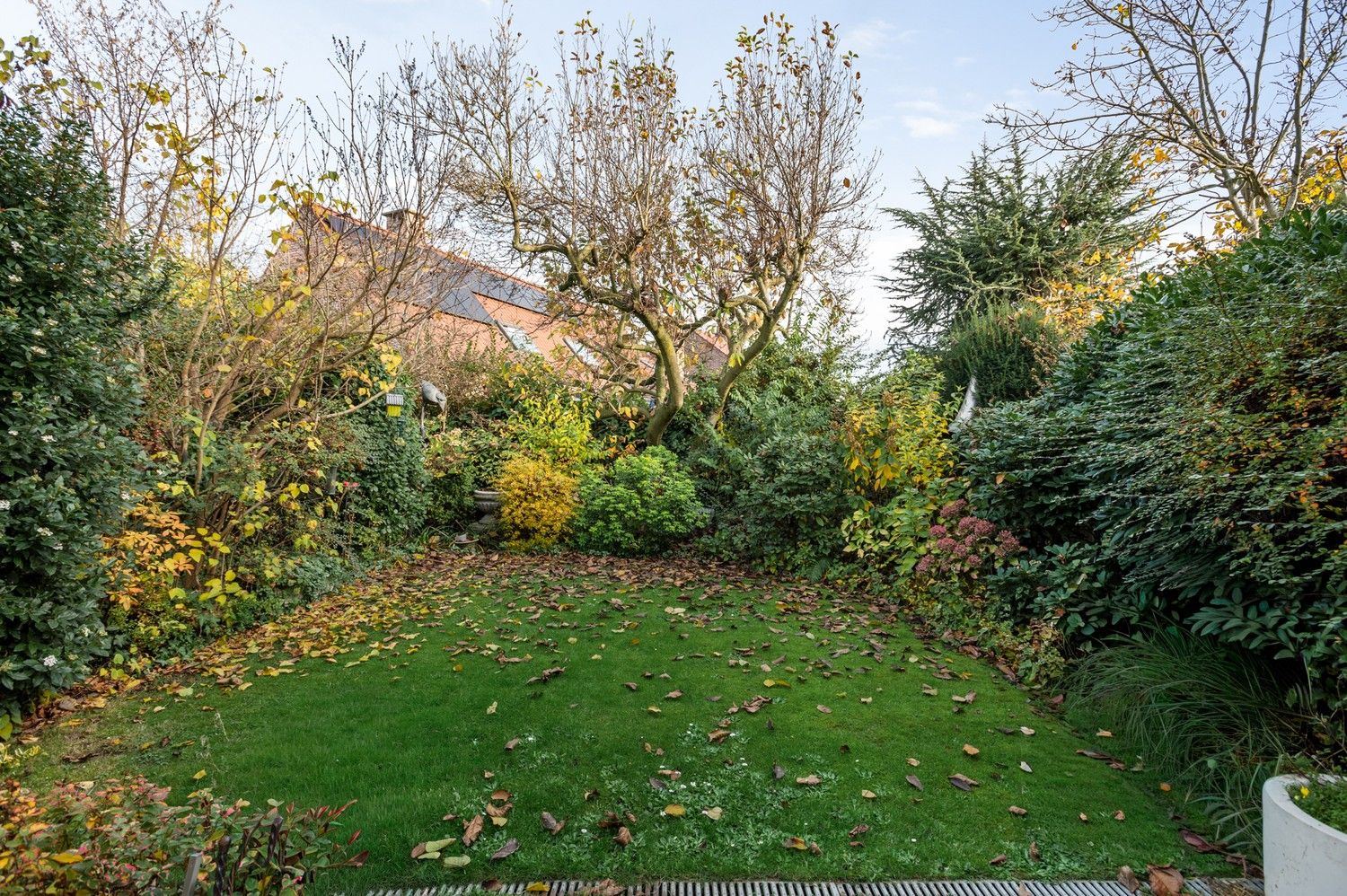 Karaktervolle halfopen woning met garage, oprit en gezellige tuin nabij het centrum van Borsbeek! foto 22