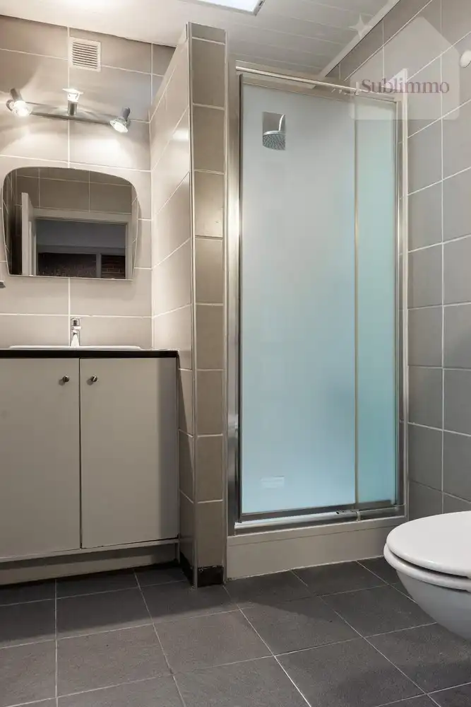 Opbrengsteigendom met 2 appartementen, tuin en garages te koop in Mol centrum foto 31