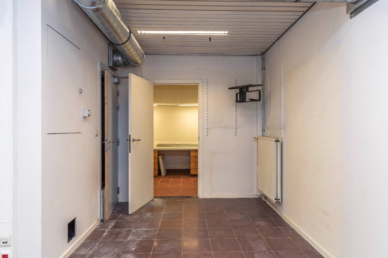 Ruim duplexappartement met gelijkvloerse handelsruimte foto 27
