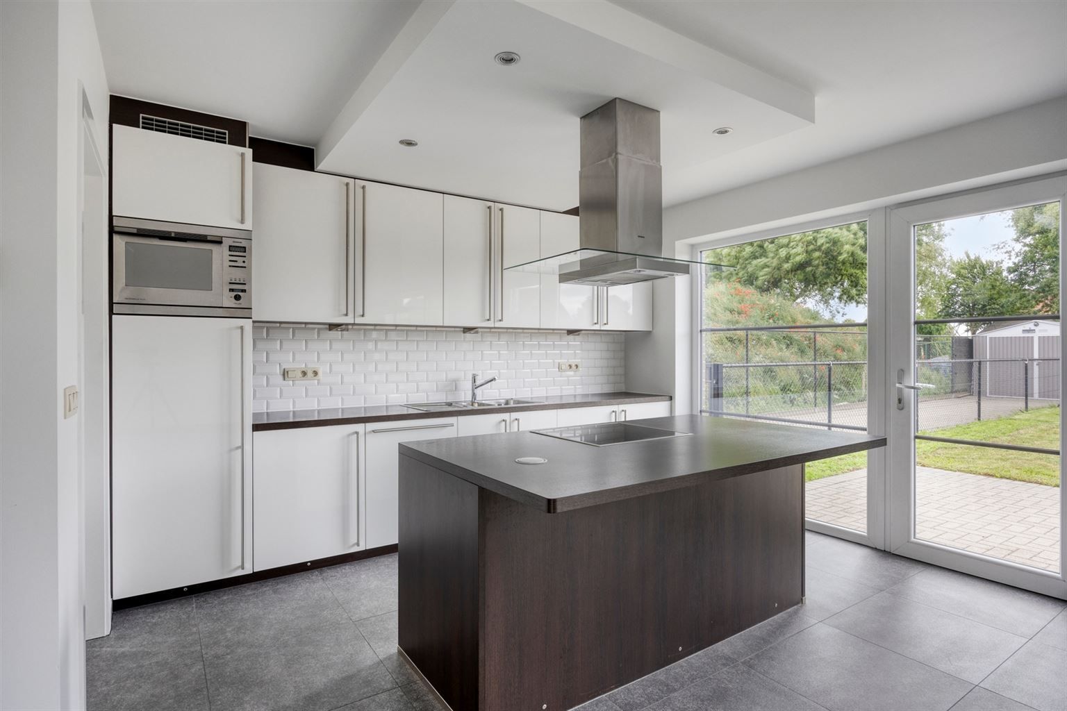 Instapklaar gelijkvloers appartement met 2 slaapkamers, ruime tuin en parkeergelegenheid op een rustige toplocatie in Opitter.  foto 6